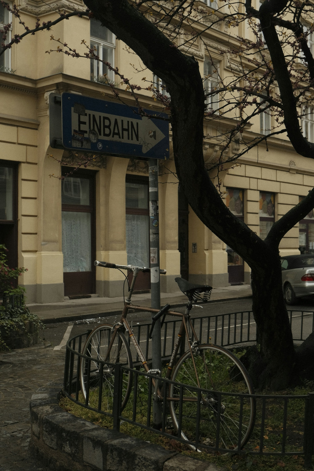 a couple of bikes parked in front of a building